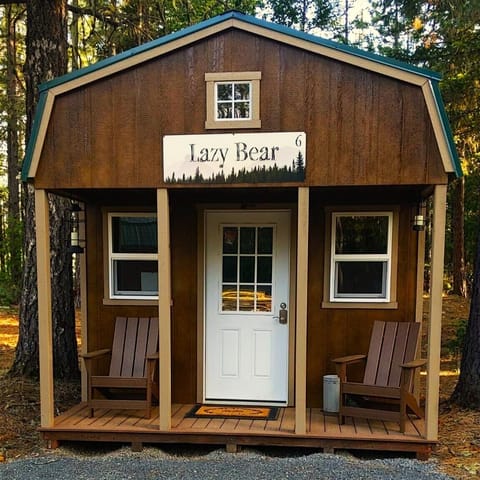 This cozy cabin, nestled among the towering pines and firs,  offers a rustic charm and a serene retreat from the hustle and bustle of everyday life. The place features a luxury king-sized bed with cozy blankets, Smart TV, a Keurig Coffee maker, Mini-fridge, a microwave, air conditioning, and heat. 