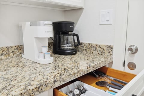 Enjoy several different coffee options and cook meals with a full set of utensils and cookware provided.