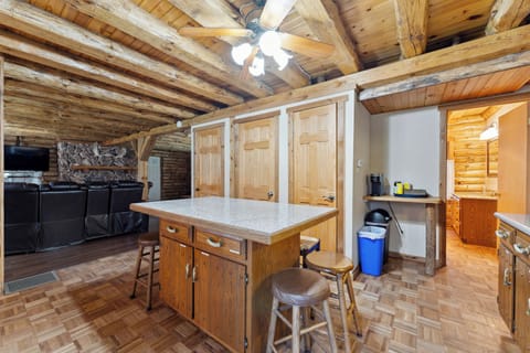 The lodge kitchen has a microwave, dishwasher, stove, fridge, Keurig