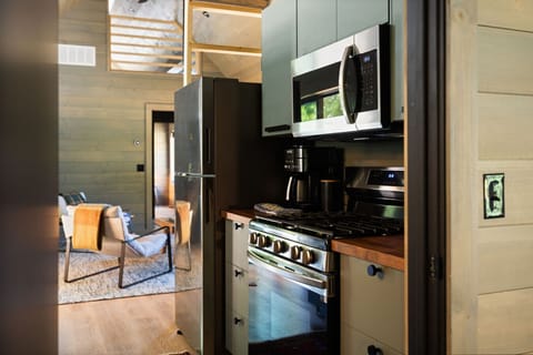 Kitchen also includes a fridge, range and microwave. All the dishes and cooking essentials you`ll need are also included.