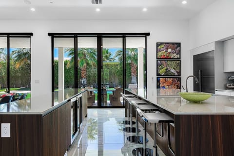 Spacious Well-Equipped Kitchen With Two Islands & Wine Refrigerator