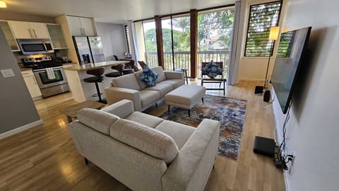 Living Room, Sofa, Love Seat, Chair, 65" Samsung 4K Smart TV. Wifi up to 500mbps