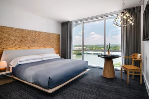 Wake up to sweeping river views from a plush bed