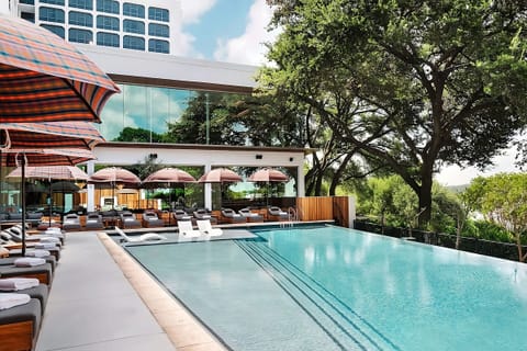 Dive into a sunlit poolside scene with luxe loungers.