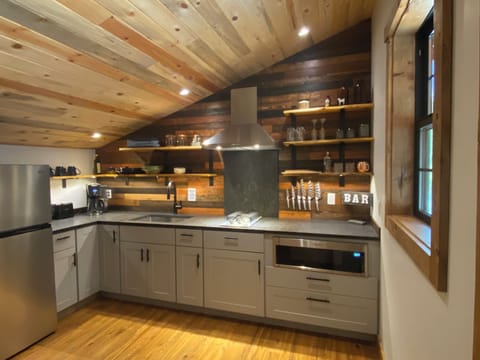 Fully stocked kitchen with high end amenities and barware.