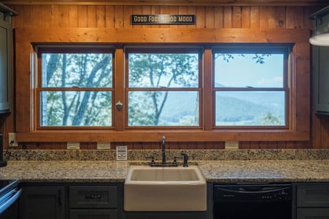 A kitchen sink graced by a luxurious marble countertop.
