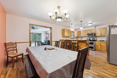Table w/7 chairs, bench that seats 3, 4 more chairs in garage, 3 bar stools