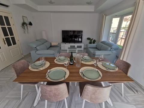 Dining / living room with AC and 65" TV