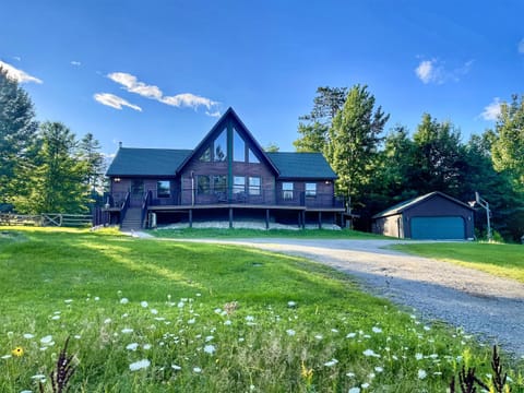 Adirondack Alpine Cabin is a 5-bedroom, 3 full bath luxury vacation rental with hot tub, expansive decking, game room and much more!