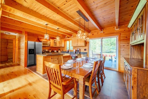 Restoration Hardware lighting, stainless appliances granite counters and a view to the outdoors make a wonderful space to cook and gather