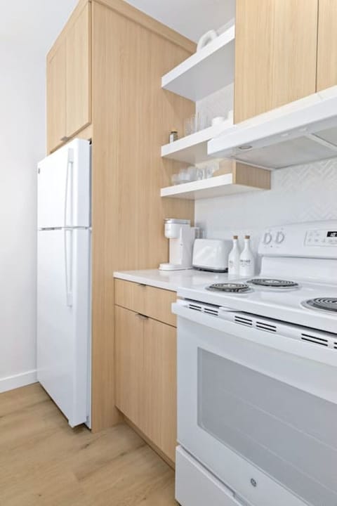Newly upgraded kitchen with open shelf design.