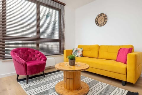 Living room with a comfortable sofa and TV. 