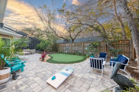 HUGE backyard with seating for all, mini put, over 2000 sq ft of paver patio!