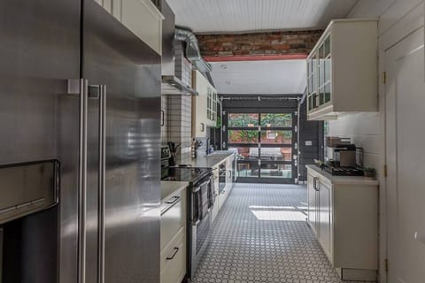 One of the unique features of our home is the garage door, which opens up to the patio. This innovative design element seamlessly blurs the line between indoor and outdoor living, allowing you to enjoy the best of both worlds.