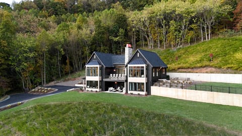 The beautiful exterior of the home faces an incredible view.