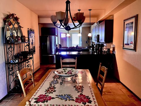 Beautiful dining room with adjoining kitchen and bar.