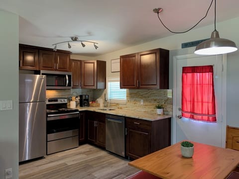 Kitchen and dining area open to the living room. 