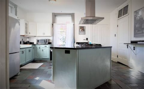 The well-stocked kitchen has an open flow and tons of light