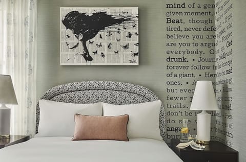 Relax into crisp bedding framed by striking, storybook wall art.