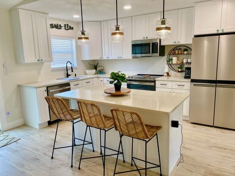Newly remodeled kitchen open to dining room and fenced back yard BBQ+firepit 
