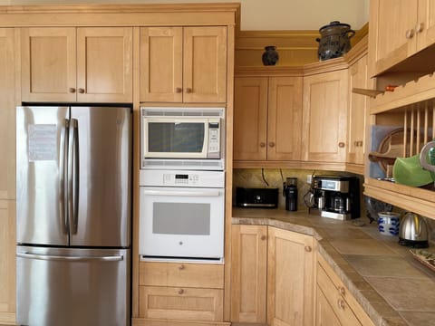 Modern kitchen appliances including combination coffee maker/espresso machine.