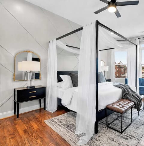 The Lincoln Room: a meticulously designed master suite adorned with a King size canopy bed & plush, luxurious bedding - truly a room fit for the President