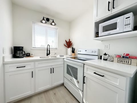 Kitchen area, standard coffee maker, microwave, electric oven/stove