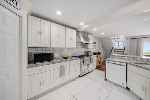 Kitchen with all the works and a double oven Cornue stove.