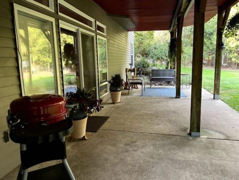 long view of the patio, bbq, and seating area