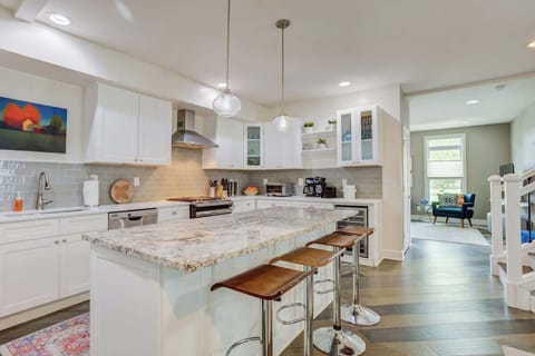 Step into a kitchen where cleanliness meets elegance. The beautiful countertop adds a touch of sophistication, making it a space that's as functional as it is visually stunning.