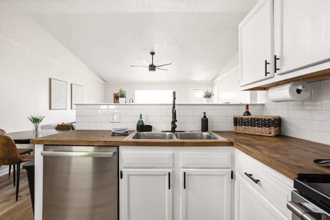 We have a sink, dishwasher, cabinets, paper towels, and essential kitchen items in our kitchen for your convenience. Please feel free to utilize these amenities throughout your stay.