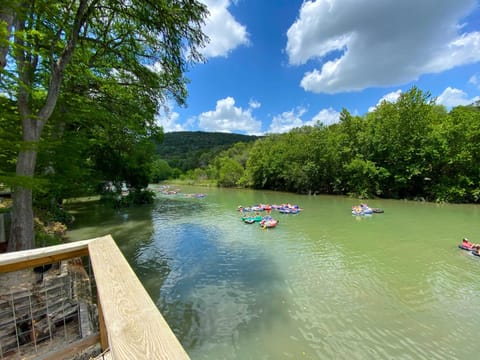Enjoy the waterfront property as tubers float by