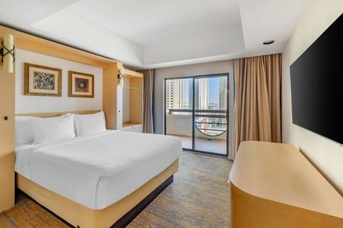 Unwind in crisp linens with sunshine and skyline views.