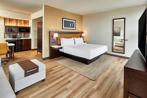 Unwind in a spacious studio suite with crisp linens.