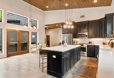 Step into a space where kitchen meets comfort, featuring a large island for gathering and an open floor plan that keeps everyone connected, from cook to couch.