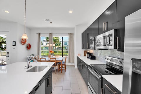 Sleek kitchen with stainless steel appliances.
