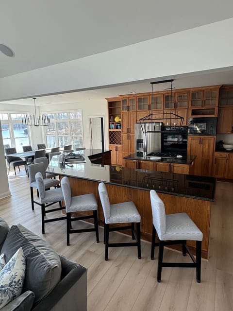 The kitchen counter features 9 cute and comfy stools for serving ease