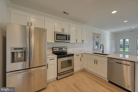 A fully equipped lower level kitchen enables multi family cooking schedules