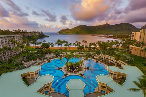 Dive into lagoon-style pools with sweeping ocean sunsets.
