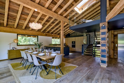Stairs from living area lead to glass-sided mezzanine 