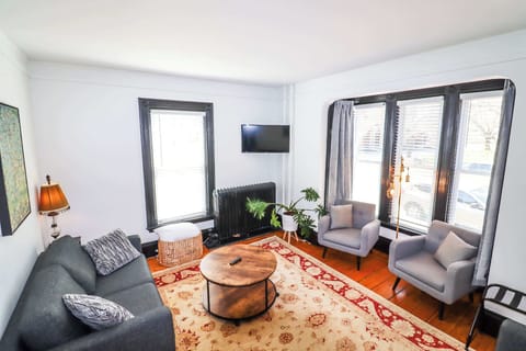 First floor living room with sun and park views