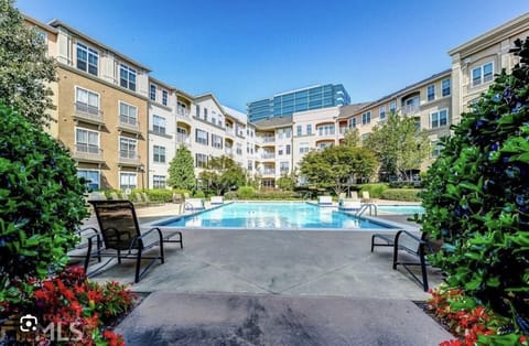 The pool is beautifully landscaped, offering a tranquil escape from the city! 