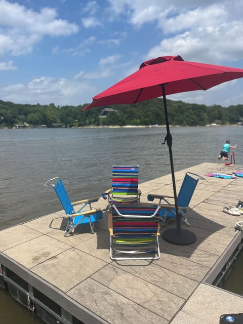 The house has six chairs and an umbrella to use down at the dock.