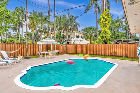 Private pool oasis with palms — perfect for swims, sun, and relaxation.