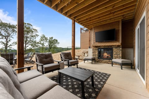 Our back patio features a cozy electric fireplace, comfortable seating, and a Smart TV. Netflix and chill at Lola's!