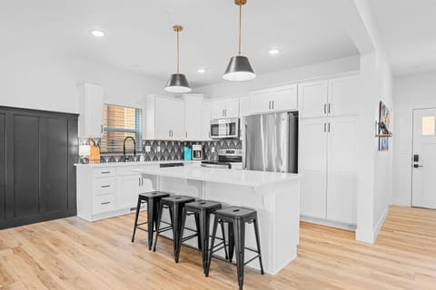 Our fully-stocked kitchen features stainless steel appliances.