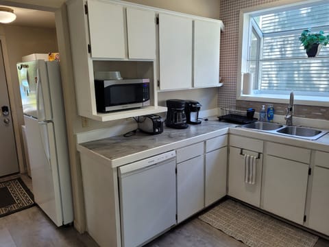 KITCHEN:  Recently updated kitchen with all appliances including a dishwasher and a good supply of cooking and dining utensils.