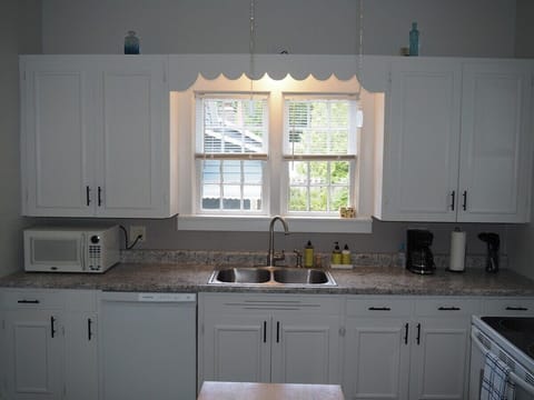 KITCHEN:  The home has a HUGE kitchen that is complete with all modern appliances, including a dishwasher.  A good supply of cooking and dining utensils are included as well.