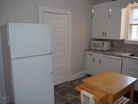 KITCHEN:  The home has a HUGE kitchen that is complete with all modern appliances, including a dishwasher.  A good supply of cooking and dining utensils are included as well.