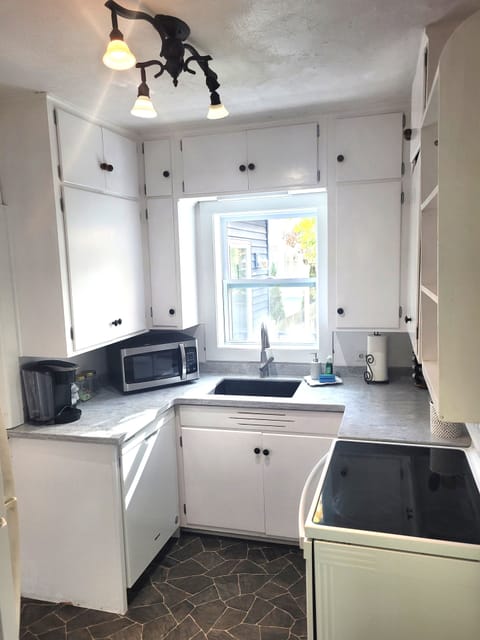 KITCHEN:  The home has a small, but very convenient, modern kitchen with all appliances (including a dishwasher) along with a good supply of cooking and dining utensils
